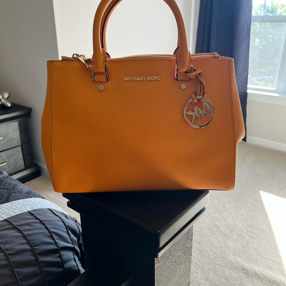Michael Kors Orange Satchel Bag with Structured Design